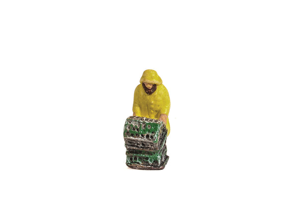 Fisherman in Yellow Oilskins with Creels